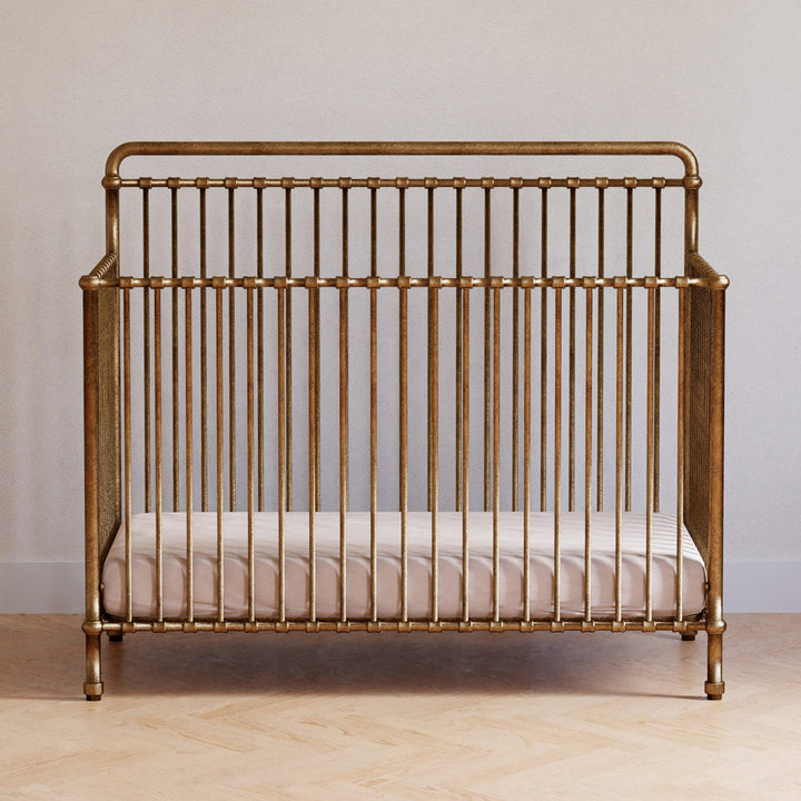 Front view of Namesake's Winston 4 in 1 Convertible Crib in a room in -- Color_Vintage Gold