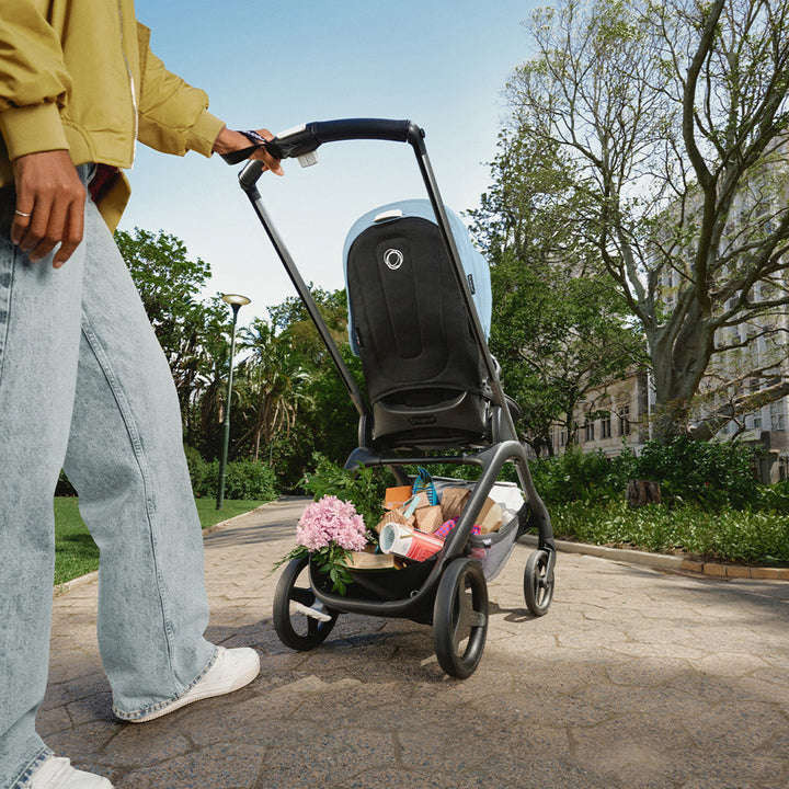 Back view of Bugaboo Dragonfly Stroller in the park in -- Color_Skyline Blue