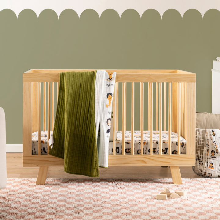 Babyletto's Quilt In 3-Layer GOTS Certified Organic Muslin Cotton on a crib rail in -- Color_Women In History