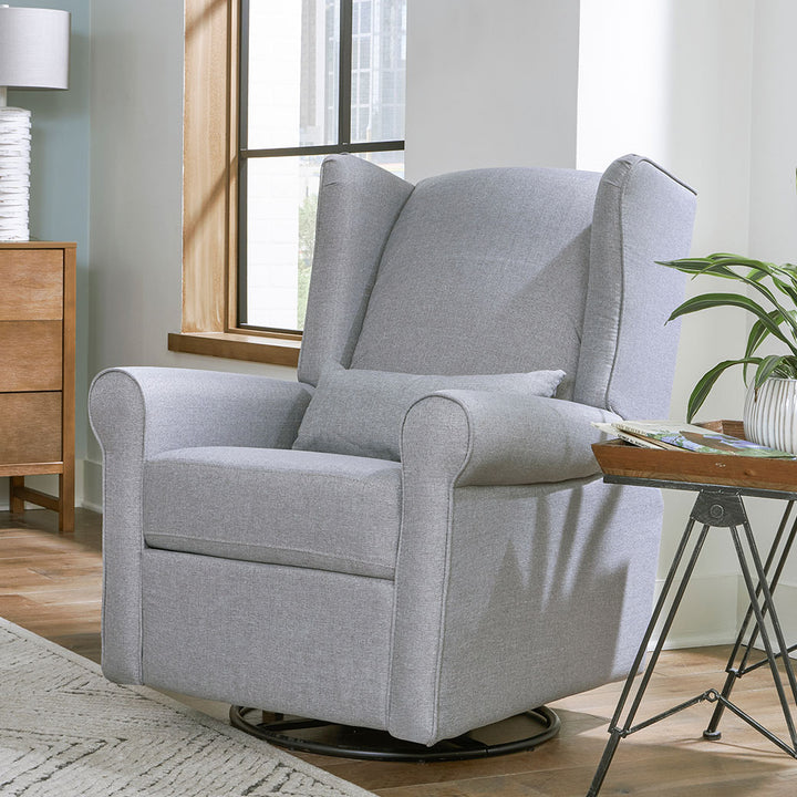 DaVinci Hayden Recliner & Swivel Glider next to a window and table in -- Color_Misty Grey