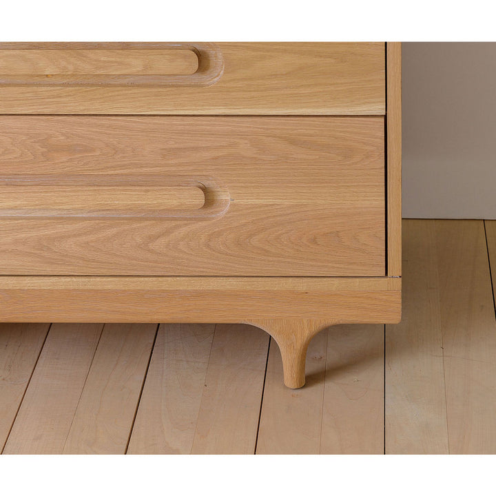 Closeup of Kalon Caravan Dresser right leg in -- Color_White Oak