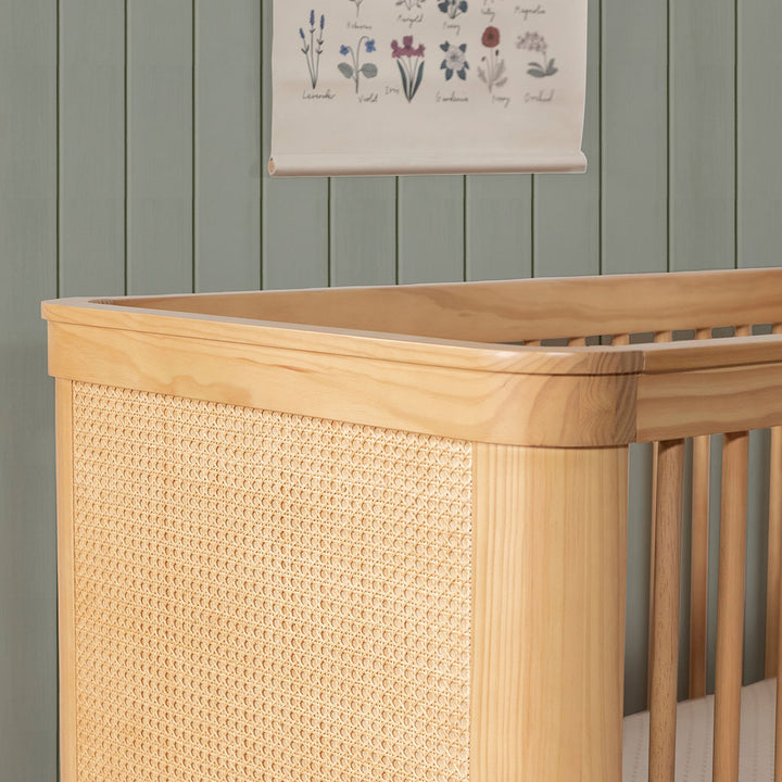 Closeup of The Namesake Marin 3-in-1 Convertible Crib left top in -- Color_Honey/Honey Cane