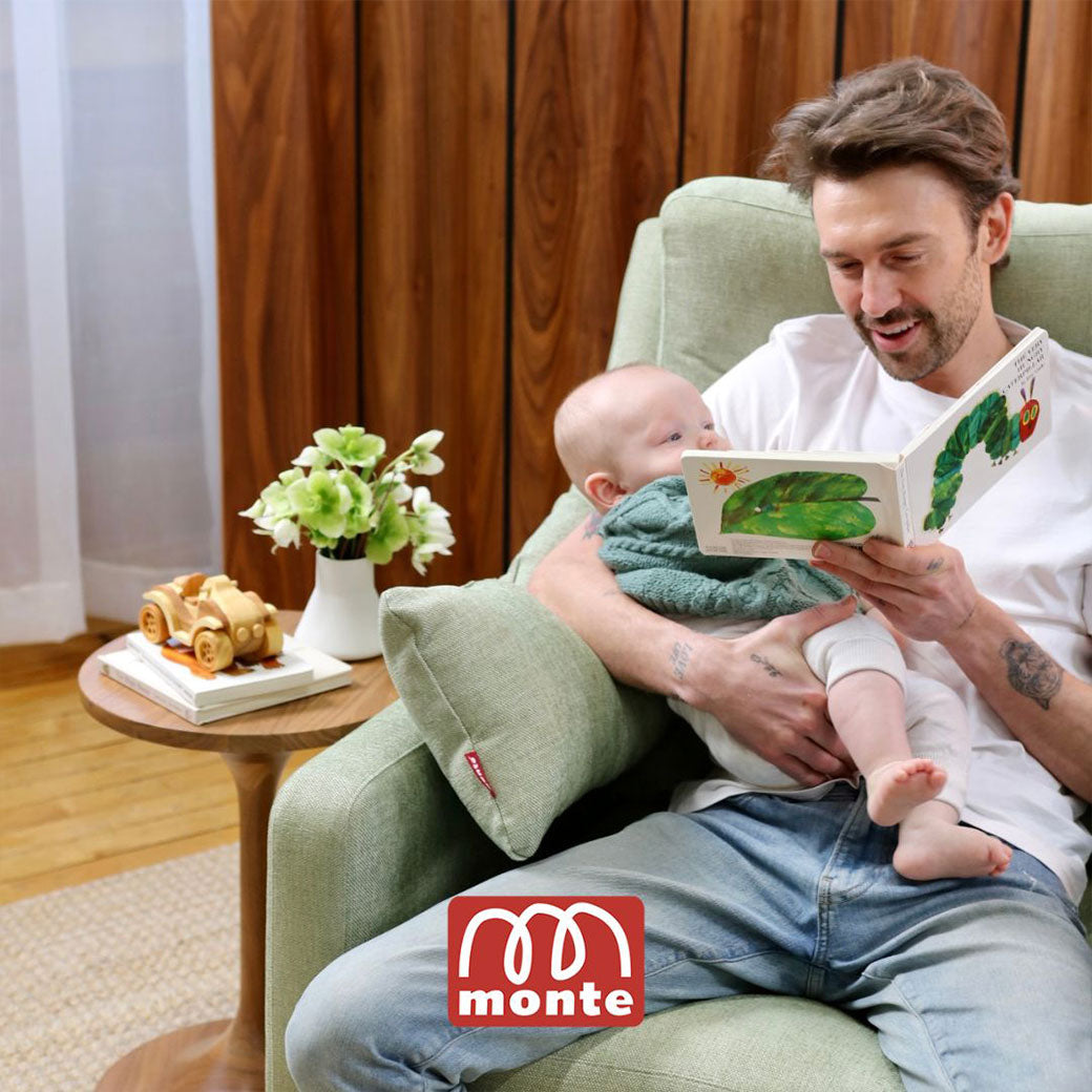 Father reading book for baby in Monte Matera Glider Recliner -- Lifestyle