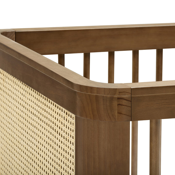 Closeup of The Namesake Marin 3-in-1 Convertible Crib in -- Color_Natural Walnut with Blonde Cane