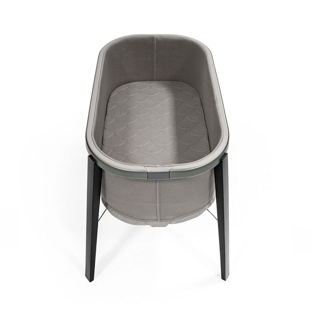 Upper view of Stokke Snoozi Bassinet with mattress in -- Color_Graphite Grey