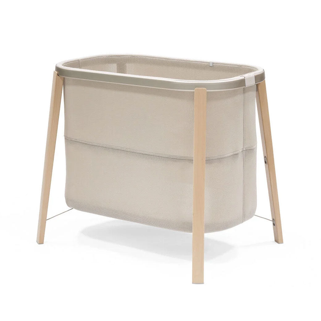 Stokke Snoozi Bassinet with mattress in low position in -- Color_Sandy Beige