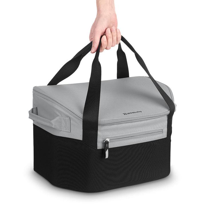 UPPAbaby Bevvy Stroller Basket Cooler with person holding the handles 