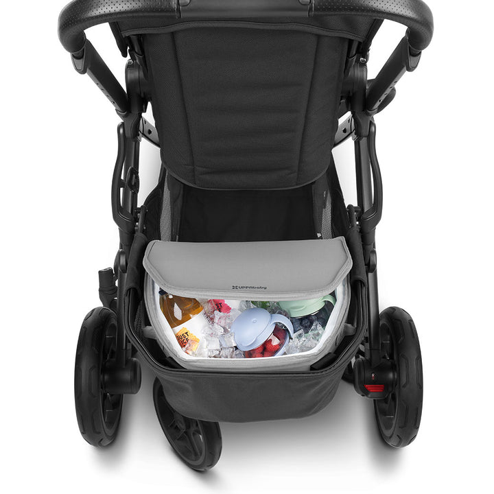 Closeup of half-open UPPAbaby Bevvy Stroller Basket Cooler with food and beverages inside