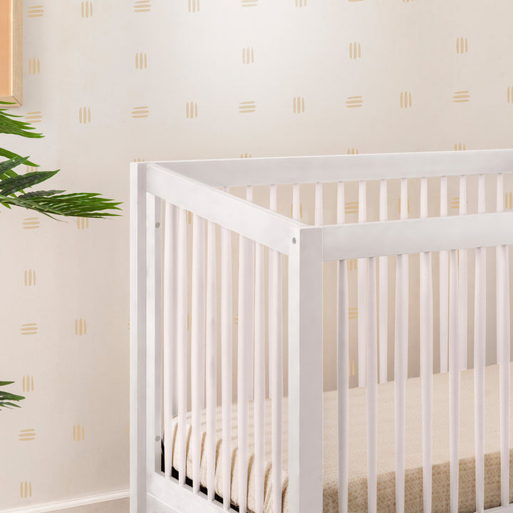 Closeup of rails of Babyletto's Sprout 4-in-1 Convertible Crib in -- Color_White