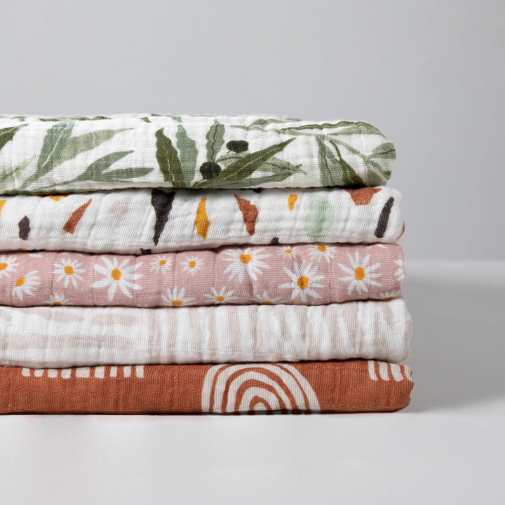 Babyletto-Swaddle-In-GOTS-Certified-Organic-Muslin-Cotton--Color_Olive Branches-Terrazzo-Daisy-Oat Stripe-Terracotta Rainbow