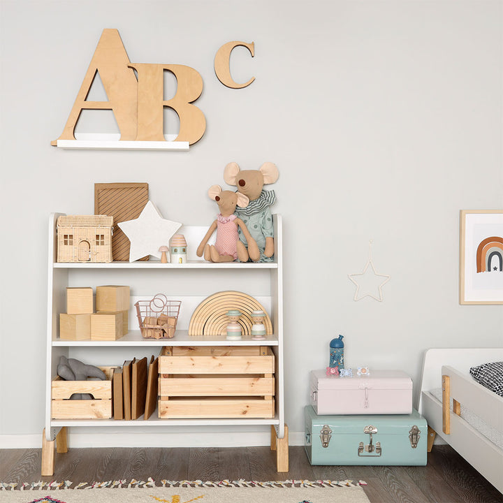 Dadada Muse Bookshelf with toys on it in a child's room