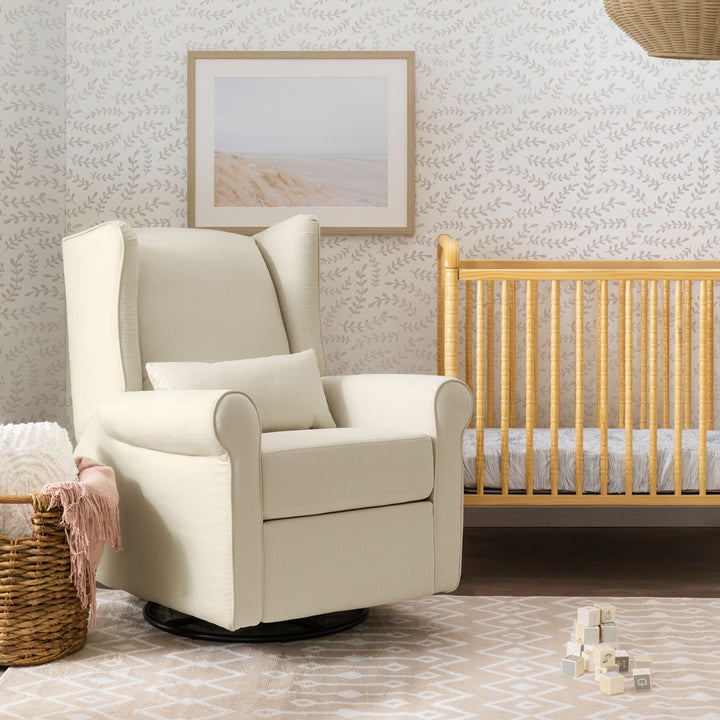 DaVinci Hayden Recliner & Swivel Glider next to a crib in -- Color_Natural Oat