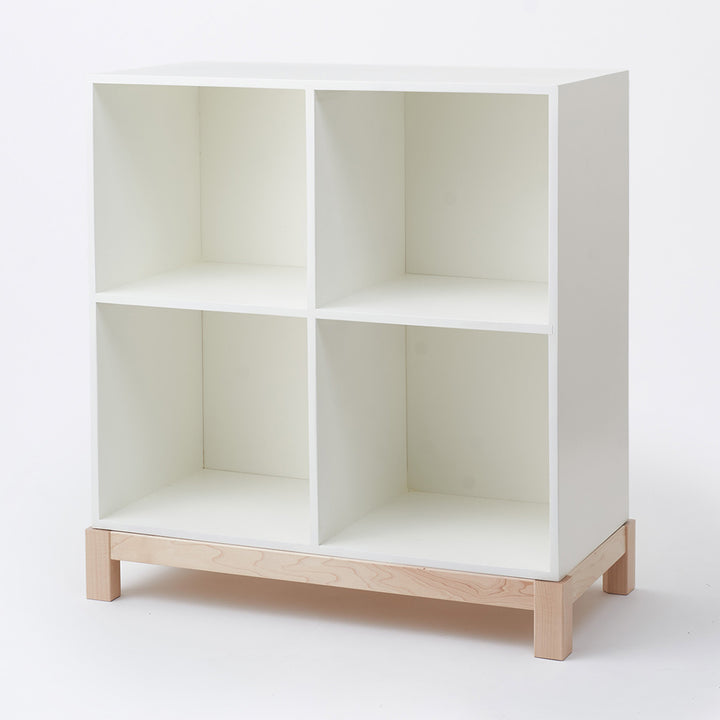 Slight side view of Milton & Goose Cubby Bookshelf in -- Color_White