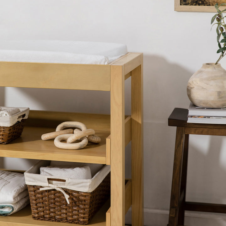 Right corner of Namesake's Nantucket Changing Table with items on it  in -- Color_Honey