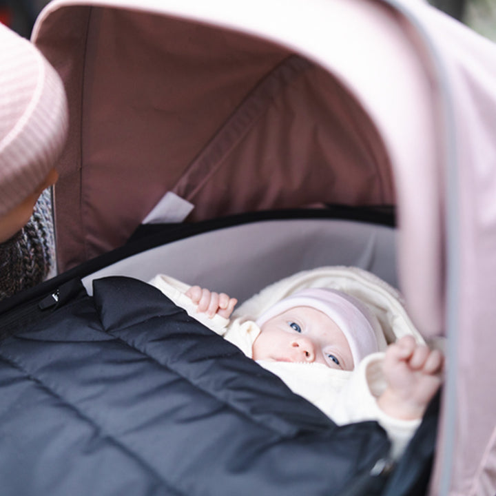 Newborn sleeping in the Thule Shine Stroller in -- Color_Misty Rose