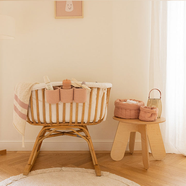 Lorena Canals Bambie Quilted Baskets on a table next to a crib in -- Color_Nude