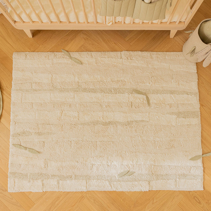 Top view of Lorena Canals Bamboo Forest Washable Rug in a baby room 