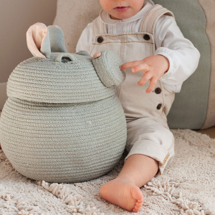 A child with the Lorena Canals Henry the Hippo Basket