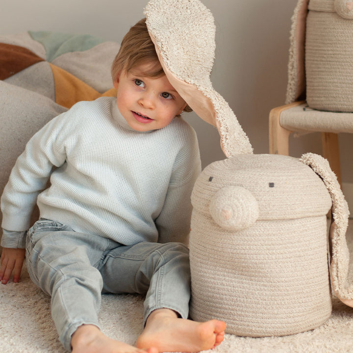 A toddler playing with the Lorena Canals Rita the Rabbit Basket